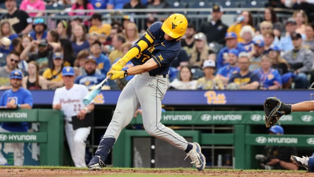 West Virginia sophomore Benjamin Lumsden smashes a two-home run to centerfield in third inning. 