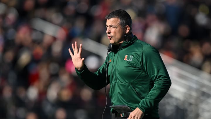 Nov 24, 2023; Chestnut Hill, Massachusetts, USA; Miami Hurricanes head coach Mario Cristobal calls a play against the Boston College Eagles during the first half at Alumni Stadium. Mandatory Credit: Brian Fluharty-USA TODAY Sports