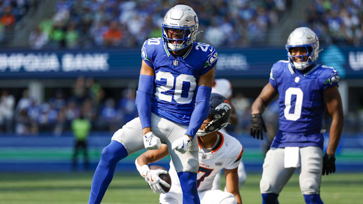 Sep 8, 2024; Seattle, Washington, USA; Seattle Seahawks safety Julian Love (20) celebrates after making a tackle against the Denver Broncos during the third quarter at Lumen Field. Mandatory Credit: Joe Nicholson-Imagn Images