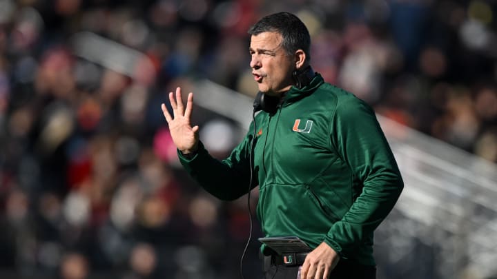 Nov 24, 2023; Chestnut Hill, Massachusetts, USA; Miami Hurricanes head coach Mario Cristobal calls a play against the Boston College Eagles during the first half at Alumni Stadium. Mandatory Credit: Brian Fluharty-USA TODAY Sports