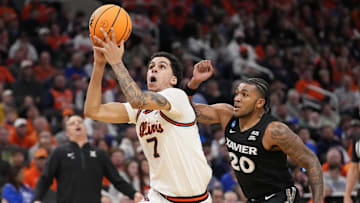 Mar 21, 2025; Milwaukee, WI, USA: Illinois Fighting Illini forward Will Riley (7) drives to the hoop past Xavier Musketeers guard Dayvion McKnight (20) during the first half at Fiserv Forum. Mandatory Credit: Jeff Hanisch-Imagn Images