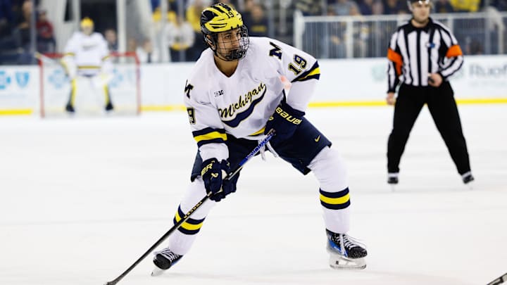 Mar 7, 2025; Ann Arbor, MI, USA;  Michigan Wolverines forward Michael Hage (19) skates with the puck against Penn State  during a Big Ten Tournament quarter final game at Yost Arena. Mandatory Credit: Rick Osentoski-Imagn Images