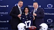 Matt Campbell, left,  Penn State University president Neeli Bendapudi, middle, and Penn State University athletic director Pat Kraft, right, pose for a photo after Campbell is announced as the Penn State Nittany Lions new head coach.