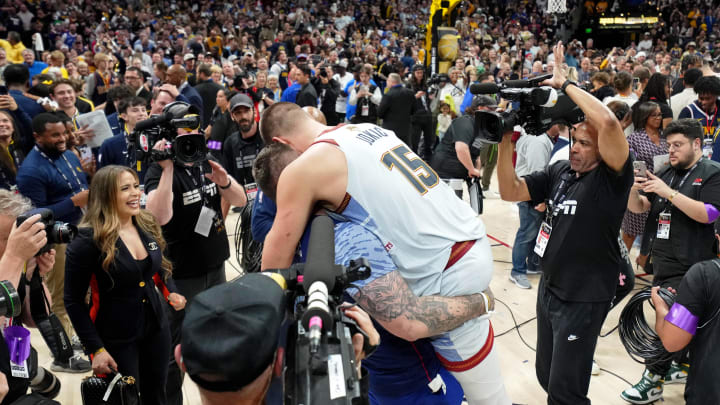 Jun 12, 2023; Denver, Colorado, USA; Denver Nuggets center Nikola Jokic (15) celebrates with his family after winning the 2023 NBA Finals against the Miami Heat at Ball Arena. Mandatory Credit: Kyle Terada-USA TODAY Sports