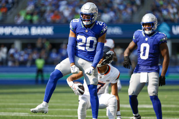 Seattle Seahawks safety Julian Love (20) celebrates after making a tackle against the Denver Broncos.