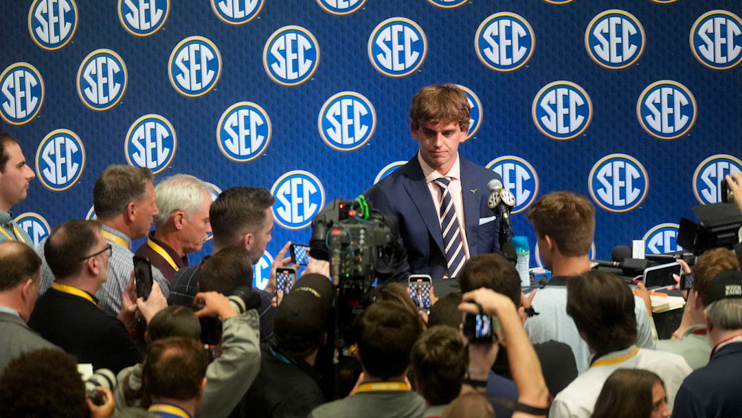 July 15, 2025; Atlanta, GA, USA; Texas quarterback Arch Manning is surrounded by media as he participates in SEC Media Days at the College Football Hall of Fame in Atlanta.