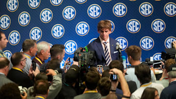 July 15, 2025; Atlanta, GA, USA; Texas quarterback Arch Manning is surrounded by media as he participates in SEC Media Days at the College Football Hall of Fame in Atlanta.