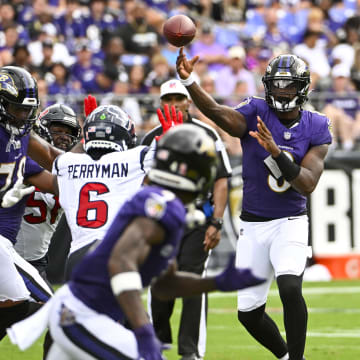 Sep 10, 2023; Baltimore, Maryland, USA; Baltimore Ravens quarterback Lamar Jackson (8) throws a pass to wide receiver Zay Flowers (4) against the Houston Texans during the second half at M&T Bank Stadium. Mandatory Credit: Brad Mills-USA TODAY Sports
