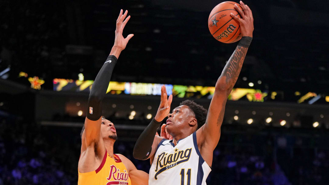 Feb 16, 2024; Indianapolis, Indiana, USA; Team Detlef forward Tyler Smith (11) of the G League Ignite shoots the ball against Team Pau center Victor Wembanyama (1) of the San Antonio Spurs during a Rising Stars semifinal game at Gainbridge Fieldhouse. Mandatory Credit: Kyle Terada-USA TODAY Sports