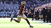 Nov 9, 2024; Chestnut Hill, Massachusetts, USA; Boston College Eagles wide receiver Lewis Bond (11) runs for a touchdown against the Syracuse Orange during the first half at Alumni Stadium. Mandatory Credit: Brian Fluharty-Imagn Images