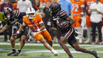 Aug 31, 2025; Atlanta, Georgia, USA; South Carolina Gamecocks defensive back Vicari Swain (4) returns a punt for a touchdown against the Virginia Tech Hokies during the second half at Mercedes-Benz Stadium. Mandatory Credit: Dale Zanine-Imagn Images