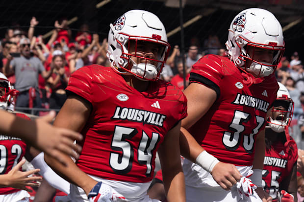 The Louisville Cardinals take the field 