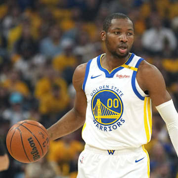 Apr 26, 2025; San Francisco, California, USA; Golden State Warriors forward Jonathan Kuminga (00) handles the ball against the Houston Rockets during the first quarter of game three of first round for the 2024 NBA Playoffs at Chase Center. Mandatory Credit: Darren Yamashita-Imagn Images