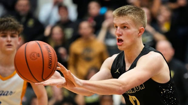 Mt. Vernon Marauders guard Luke Ertel (12) passes the ball 