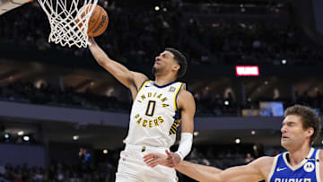 Mar 15, 2025; Milwaukee, Wisconsin, USA;  Indiana Pacers guard Tyrese Haliburton (0) drives for a dunk during the second quarter against the Milwaukee Bucks at Fiserv Forum. Mandatory Credit: Jeff Hanisch-Imagn Images