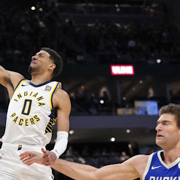 Mar 15, 2025; Milwaukee, Wisconsin, USA;  Indiana Pacers guard Tyrese Haliburton (0) drives for a dunk during the second quarter against the Milwaukee Bucks at Fiserv Forum. Mandatory Credit: Jeff Hanisch-Imagn Images