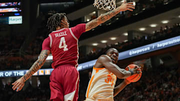 Tennessee forward Felix Okpara (34) ducks away from Arkansas forward Trevon Brazile (4) during a college basketball game between Tennessee and Arkansas held at Thompson-Boling Arena at Food City Center in Knoxville, Tenn., on Saturday, January 4, 2025. Tennessee won 76-52 against Arkansas.