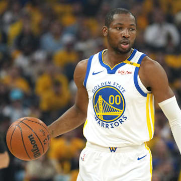 Apr 26, 2025; San Francisco, California, USA; Golden State Warriors forward Jonathan Kuminga (00) handles the ball against the Houston Rockets during the first quarter of game three of first round for the 2024 NBA Playoffs at Chase Center. Mandatory Credit: Darren Yamashita-Imagn Images