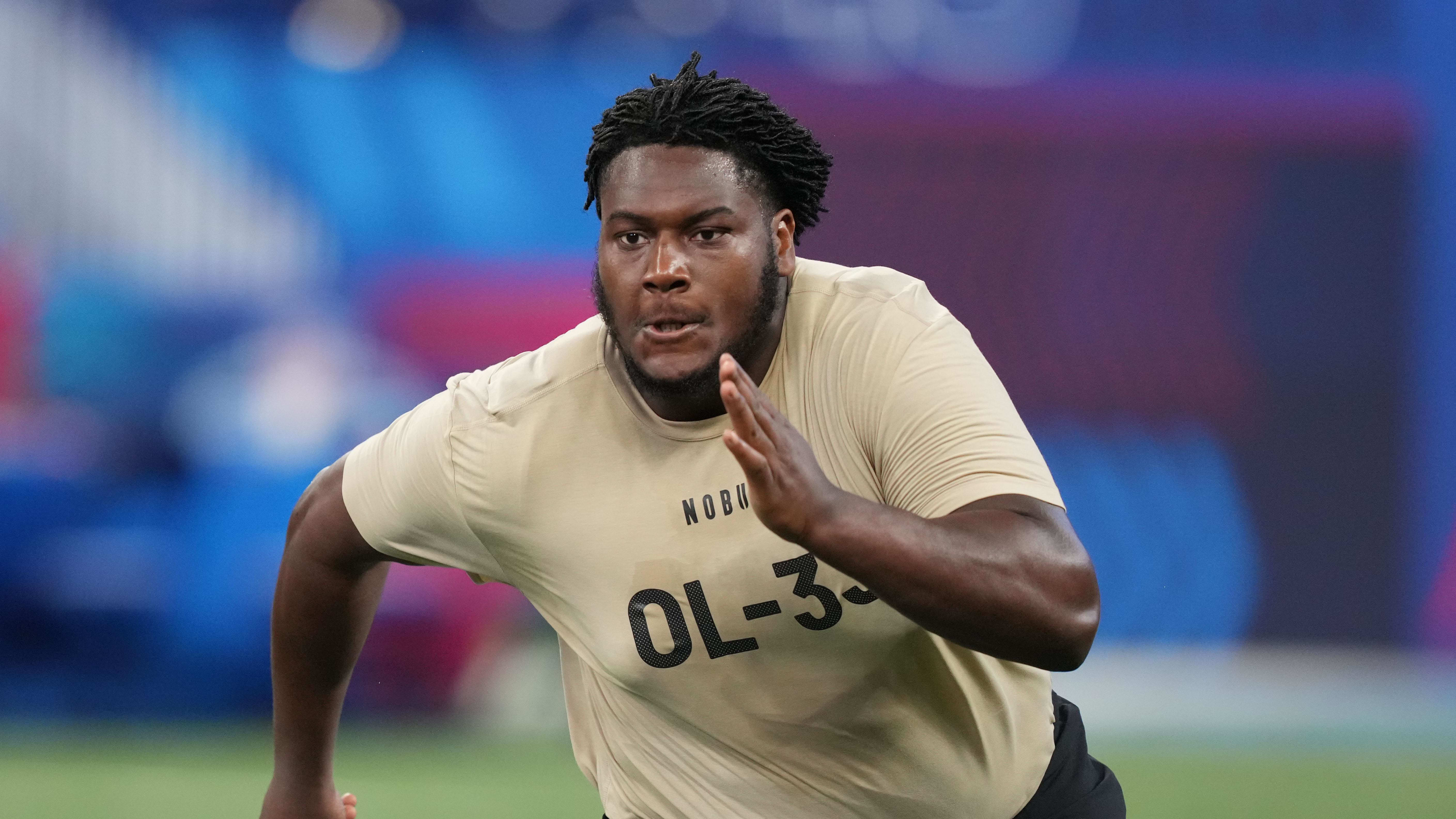 Connecticut offensive lineman Christian Haynes (OL33) during the 2024 NFL Scouting Combine.
