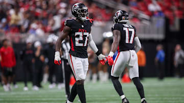 Aug 15, 2025; Atlanta, Georgia, USA; Atlanta Falcons linebacker James Pearce Jr. (27)  comes in the game as linebacker Arnold Ebiketie (17) exits against the Tennessee Titans in the second quarter at Mercedes-Benz Stadium. Mandatory Credit: Brett Davis-Imagn Images

