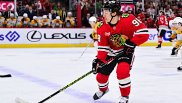 Feb 7, 2025; Chicago, Illinois, USA; Chicago Blackhawks center Connor Bedard (98) skates with the puck against the Nashville Predators during the first period at the United Center. Mandatory Credit: Daniel Bartel-Imagn Images