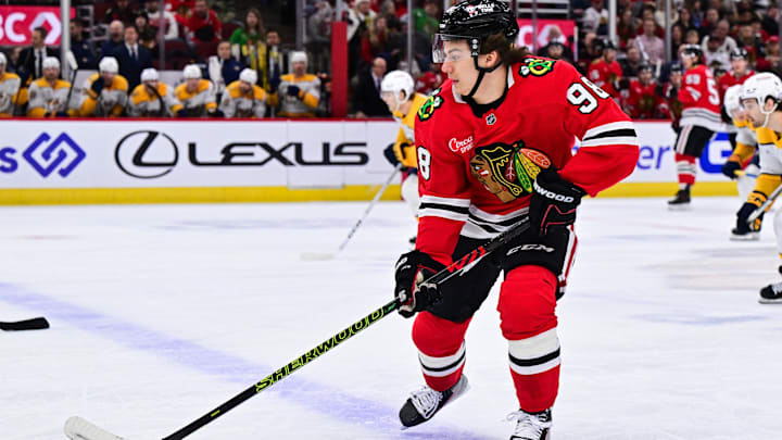 Feb 7, 2025; Chicago, Illinois, USA; Chicago Blackhawks center Connor Bedard (98) skates with the puck against the Nashville Predators during the first period at the United Center. Mandatory Credit: Daniel Bartel-Imagn Images