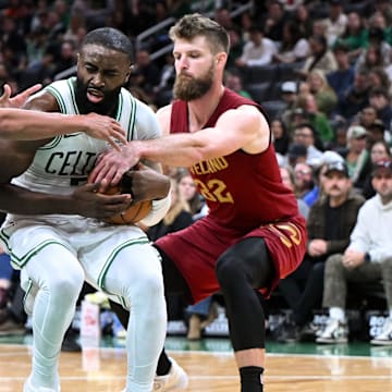 Oct 12, 2025; Boston, Massachusetts, USA; Cleveland Cavaliers forward/center Larry Nance Jr. (22) defends Boston Celtics guard/forward Jaylen Brown (7) during the first half at TD Garden. Mandatory Credit: Brian Fluharty-Imagn Images
