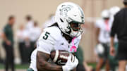 Oct 18, 2025; Bloomington, Indiana, USA; Michigan State Spartans running back Makhi Frazier (5) runs the ball prior to the game against the Indiana Hoosiers at Memorial Stadium. Mandatory Credit: Robert Goddin-Imagn Images