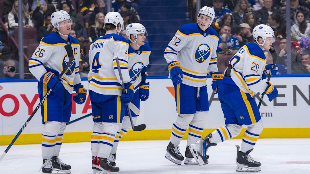 Jan 21, 2025; Vancouver, British Columbia, CAN; Buffalo Sabres defenseman Rasmus Dahlin (26) and defenseman Bowen Byram (4) and forward JJ Peterka (77) and forward Tage Thompson (72) and forward Jiri Kulich (20) celebrate Kulich’s goal against the Vancouver Canucks in the third period at Rogers Arena. Mandatory Credit: Bob Frid-Imagn Images