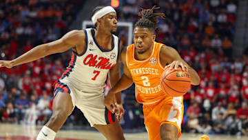 Mar 5, 2025; Oxford, Mississippi, USA; Tennessee Volunteers guard Chaz Lanier (2) drives against Mississippi Rebels guard Davon Barnes (7) during the first half at The Sandy and John Black Pavilion at Ole Miss. Mandatory Credit: Wesley Hale-Imagn Images