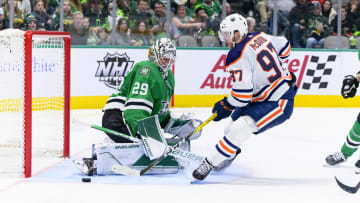 Mar 22, 2022; Dallas, Texas, USA; Dallas Stars goaltender Jake Oettinger (29) stops a breakaway shot by Edmonton Oilers center Connor McDavid (97) during the third period at the American Airlines Center. Mandatory Credit: Jerome Miron-USA TODAY Sports