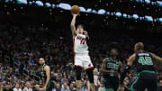 May 1, 2024; Boston, Massachusetts, USA; Miami Heat guard Tyler Herro (14) shoots as Boston Celtics guard Jrue Holiday (4) looks on during the first quarter of game five of the first round of the 2024 NBA playoffs at TD Garden. Mandatory Credit: Winslow Townson-USA TODAY Sports