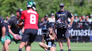 Jul 22, 2023; Florham Park, NJ, USA;  An NFL Films crew  for the HBO television series Hard Knocks films as New York Jets quarterback Aaron Rodgers (8) participates in drills during the New York Jets Training Camp at Atlantic Health Jets Training Center. Mandatory Credit: Vincent Carchietta-Imagn Images