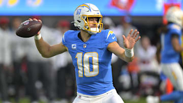 Dec 15, 2024; Inglewood, California, USA;  Los Angeles Chargers quarterback Justin Herbert (10) sets to pass in the first half against the Tampa Bay Buccaneers at SoFi Stadium. Mandatory Credit: Jayne Kamin-Oncea-Imagn Images