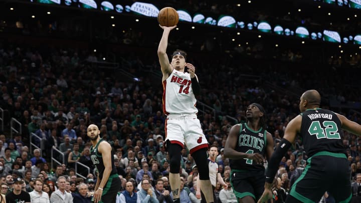 May 1, 2024; Boston, Massachusetts, USA; Miami Heat guard Tyler Herro (14) shoots as Boston Celtics guard Jrue Holiday (4) looks on during the first quarter of game five of the first round of the 2024 NBA playoffs at TD Garden. Mandatory Credit: Winslow Townson-USA TODAY Sports