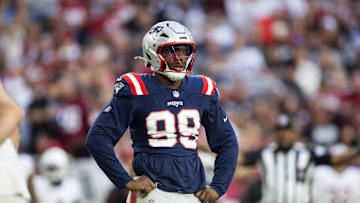 Dec 15, 2024; Glendale, Arizona, USA; New England Patriots defensive end Keion White (99) against the Arizona Cardinals at State Farm Stadium. Mandatory Credit: Mark J. Rebilas-Imagn Images