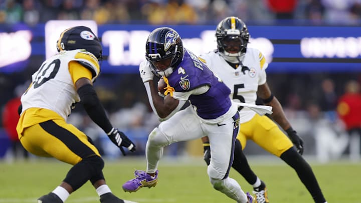 Dec 7, 2025; Baltimore, Maryland, USA; Baltimore Ravens wide receiver Zay Flowers (4) runs with the ball after making a catch against the Pittsburgh Steelers during the second half at M&T Bank Stadium. Mandatory Credit: Peter Casey-Imagn Images