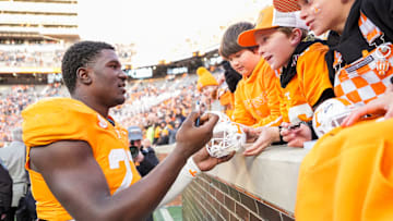 Tennessee defensive lineman James Pearce Jr. autographs items for children after a college football game between Tennessee and UTEP at Neyland Stadium in Knoxville, Tennessee, on Saturday, Nov. 23, 2024.