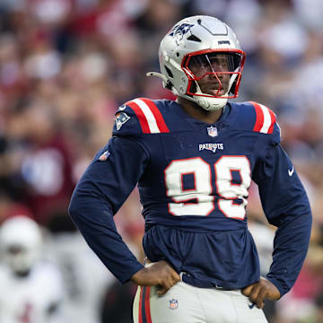 Dec 15, 2024; Glendale, Arizona, USA; New England Patriots defensive end Keion White (99) against the Arizona Cardinals at State Farm Stadium. Mandatory Credit: Mark J. Rebilas-Imagn Images
