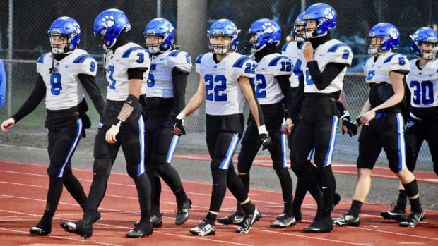 Bothell comes out of locker room from pre-game warmups in a round of 32 playoff games in 2023 against Emerald Ridge.