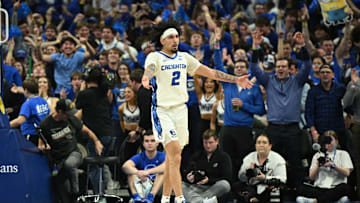 Dec 4, 2024; Omaha, Nebraska, USA; Creighton Bluejays guard Pop Isaacs (2) reacts to the crowd after making a three point basket against the Kansas Jayhawks during the second half at CHI Health Center Omaha. Mandatory Credit: Steven Branscombe-Imagn Images