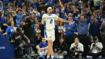 Dec 4, 2024; Omaha, Nebraska, USA; Creighton Bluejays guard Pop Isaacs (2) reacts to the crowd after making a three point basket against the Kansas Jayhawks during the second half at CHI Health Center Omaha. Mandatory Credit: Steven Branscombe-Imagn Images