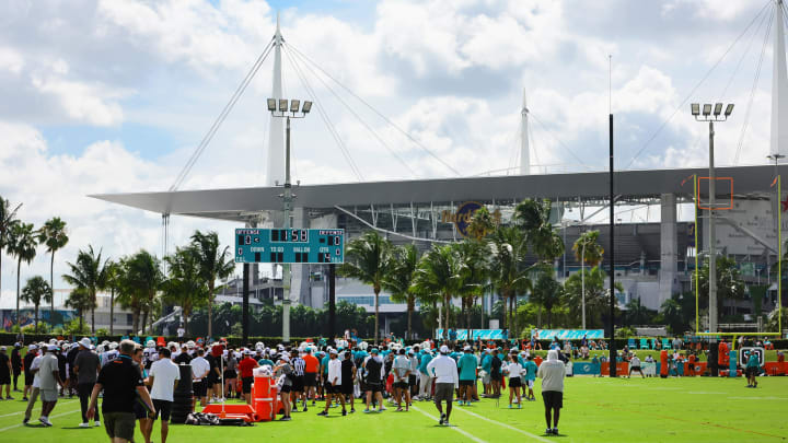 Miami Dolphins and Atlanta Falcons football players gather on the field during a joint practice at Baptist Health Training Complex. 