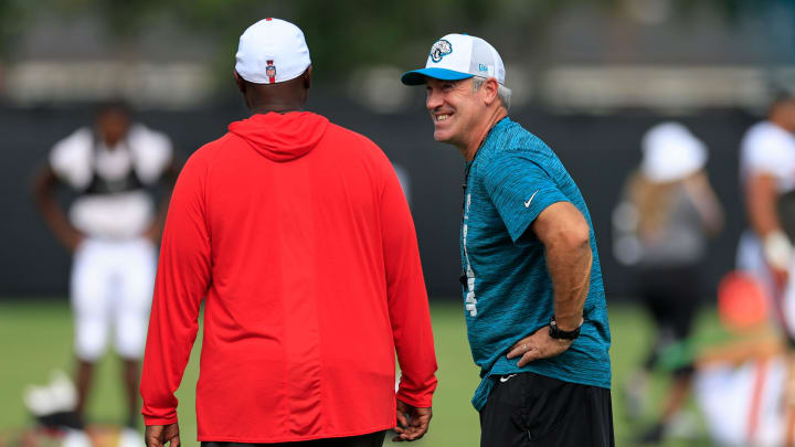 Jacksonville Jaguars head coach Doug Pederson laughs with Tampa Bay Buccaneers head coach Todd Bowles during a combined NFL football training camp session between the Tampa Bay Buccaneers and Jacksonville Jaguars Wednesday, Aug. 14, 2024 at EverBank Stadium’s Miller Electric Center in Jacksonville, Fla. [Corey Perrine/Florida Times-Union]