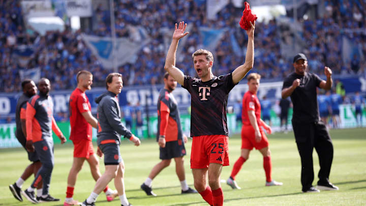 Thomas Muller celebrating with fans after Bayern Munich clinched 4-0 win away at Hoffenheim.