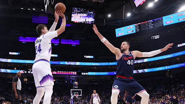 Oct 22, 2025; Salt Lake City, Utah, USA; Utah Jazz center Walker Kessler (24) makes a three point shot over Los Angeles Clipp