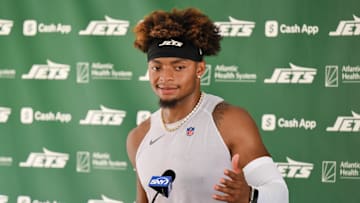 Jul 23, 2025; Florham Park, NY, USA; New York Jets quarterback Justin Fields (7) speaks at a press conference during training camp at Atlantic Health Jets Training Center. Mandatory Credit: John Jones-Imagn Images