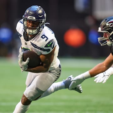 Seattle Seahawks running back Kenneth Walker III runs the ball against the Atlanta Falcons.