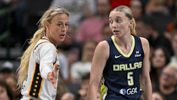 Aug 1, 2025; Dallas, Texas, USA; Dallas Wings guard Paige Bueckers (5) and Indiana Fever guard Sophie Cunningham (8) in action during the game between the Dallas Wings and the Indiana Fever at the American Airlines Center. Mandatory Credit: Jerome Miron-Imagn Images