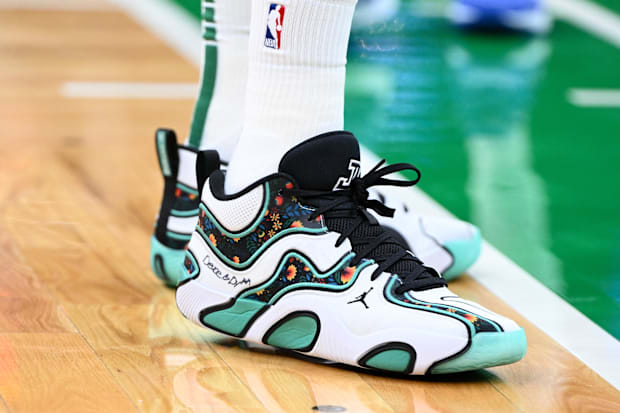 Boston Celtics forward Jayson Tatum's white and green sneakers.
